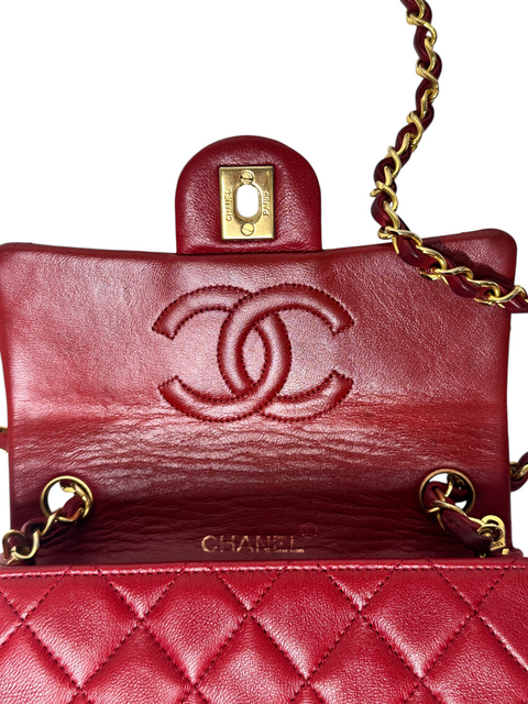 CHEZ SNOW BUNNY Chanel Mini Matelasse bag in red lambskin leather with gold chain strap and embossed CC logo