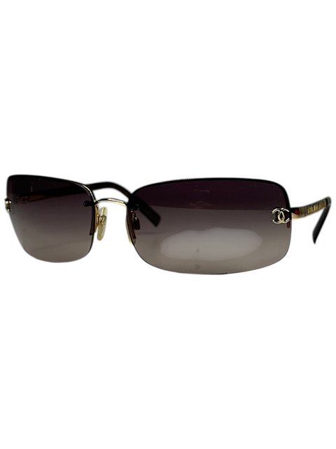 CHEZ SNOW BUNNY Chanel gold sunglasses with gradient lenses and iconic logo detail on the temple