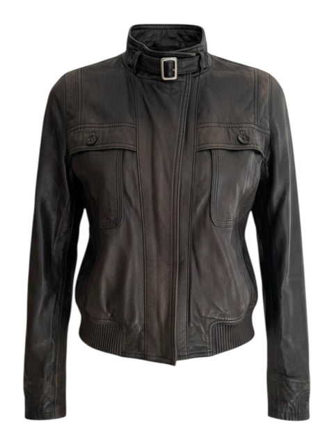 CHEZ SNOW BUNNY brown leather jacket featuring a high collar with buckle strap and two front chest pockets.