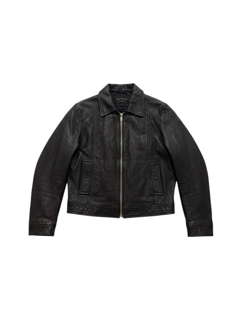 CHEZ SNOW BUNNY Vent Couvert black leather jacket with a front zipper closure and classic collar design.