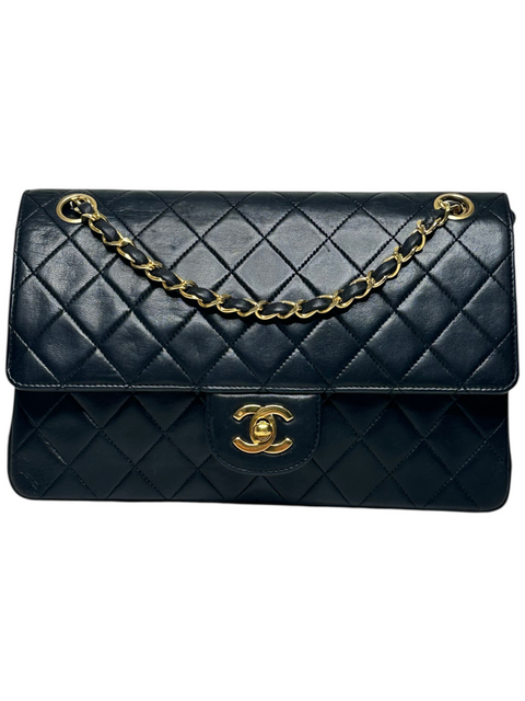 CHEZ SNOW BUNNY Chanel black lambskin 25cm double chain bag with gold hardware and iconic quilted pattern