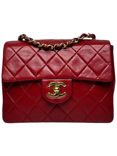 CHEZ SNOW BUNNY Chanel Mini Matelasse bag in red lambskin leather with gold-tone chain strap and CC turn-lock closure.